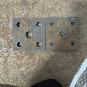 Two MasterCut Compact cut example showing different sized circles cut from square steel plates.